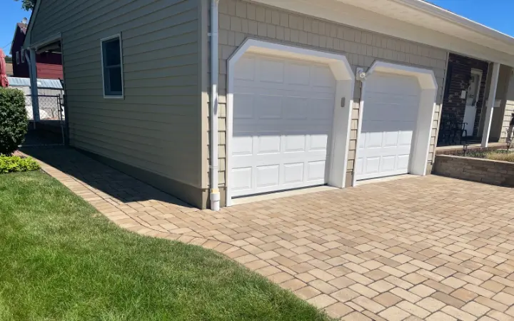 Custom Garage Door Installation with Paver Driveway